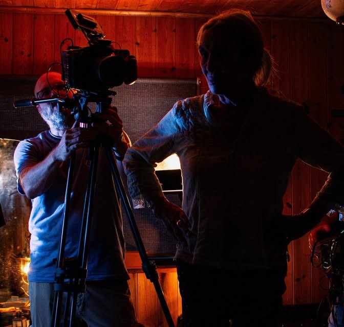 Behind-the-scenes film crew working with a camera